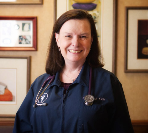 vet standing and smiling